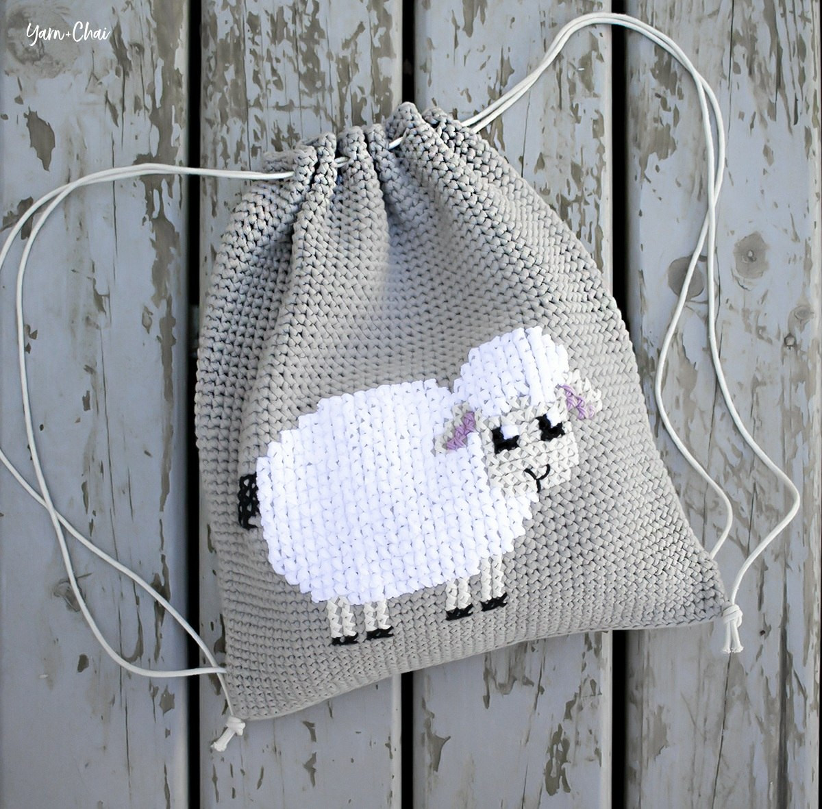 Cross-stitched Lamb Cinched Backpack Pattern by Yarn + Chai