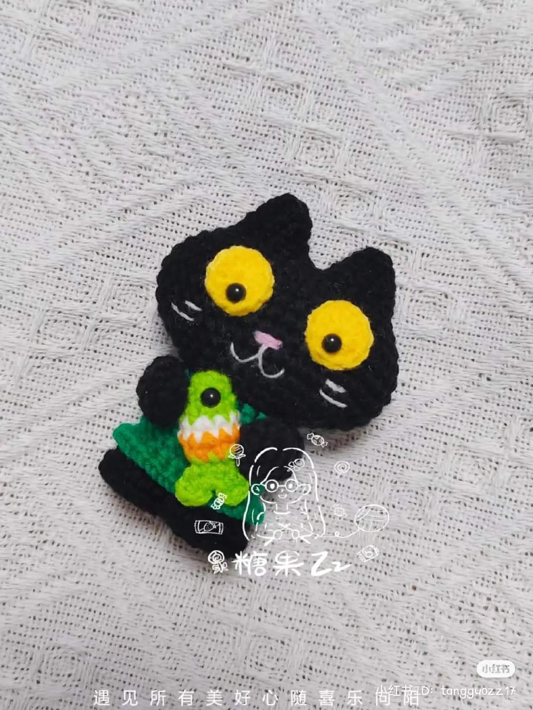 Cute Black Cat Amigurumi Crochet Pattern Chart Holding a Green Fish