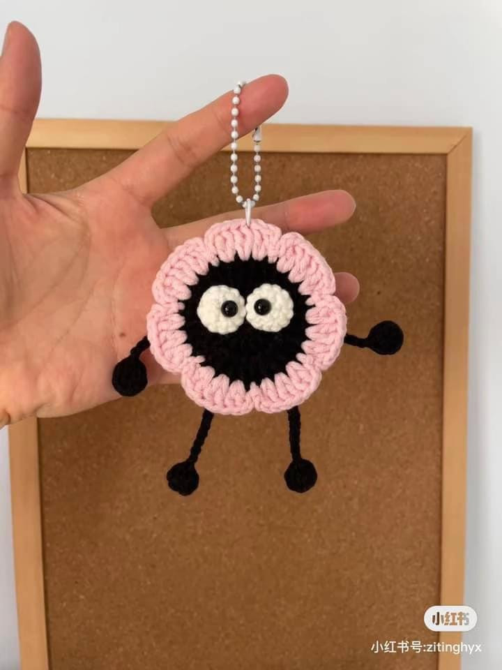 Cute Crochet Flower Monster Amigurumi Keychain Pattern with Pink Petals and Black Body