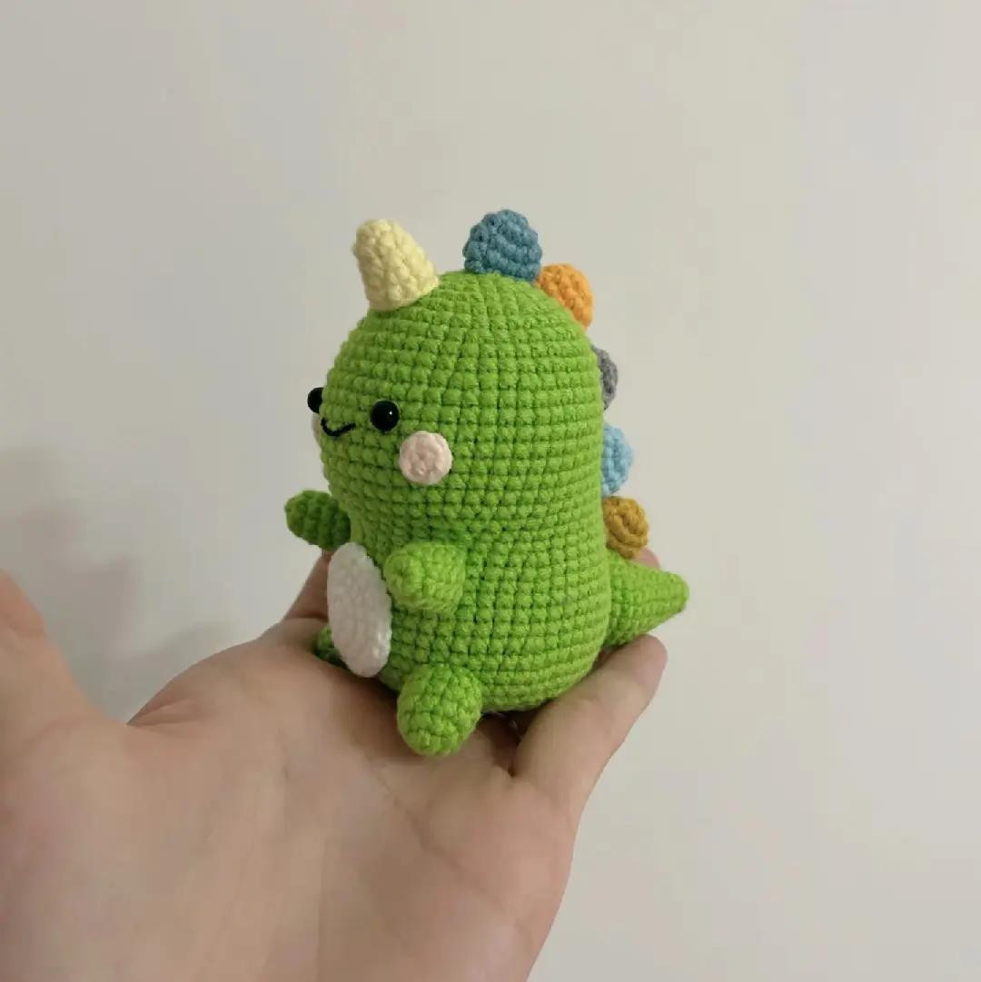 Cute Green Crochet Dinosaur Amigurumi Pattern Tutorial with Colorful Spikes and White Belly