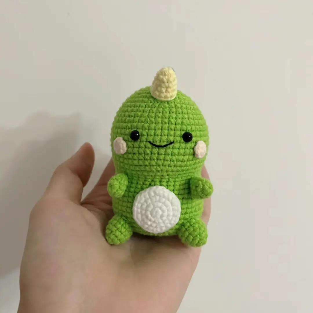 Cute Green Crochet Dinosaur Amigurumi Pattern Tutorial with Colorful Spikes and White Belly