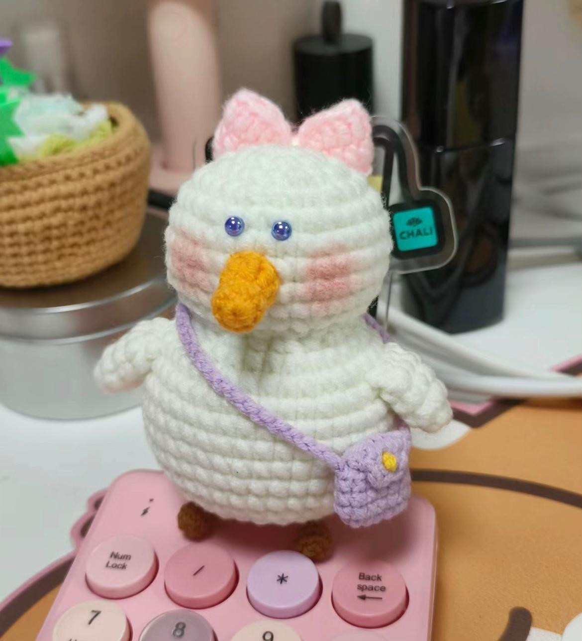 Cute White Crochet Duck with Pink Bow and Purple Bag Amigurumi Pattern