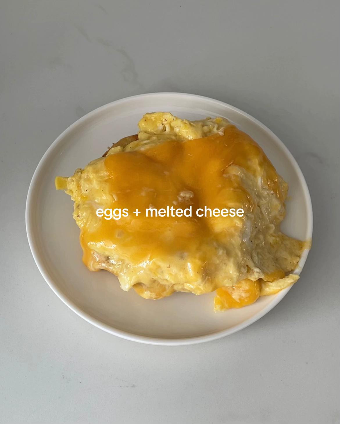 Easy Breakfast Bun with Scrambled Eggs, Melted Cheese, Kewpie Mayo, and Chili Flakes