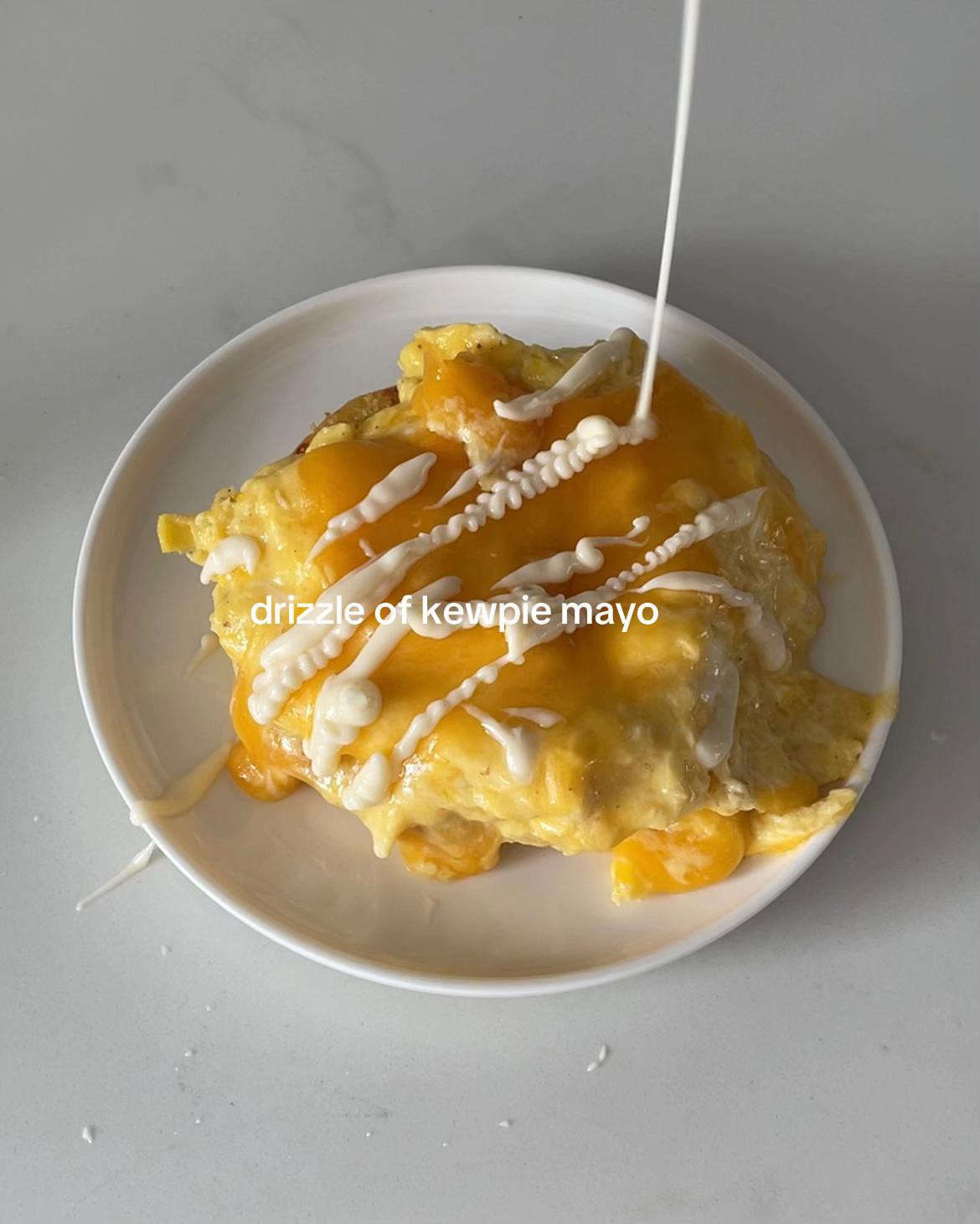 Easy Breakfast Bun with Scrambled Eggs, Melted Cheese, Kewpie Mayo, and Chili Flakes