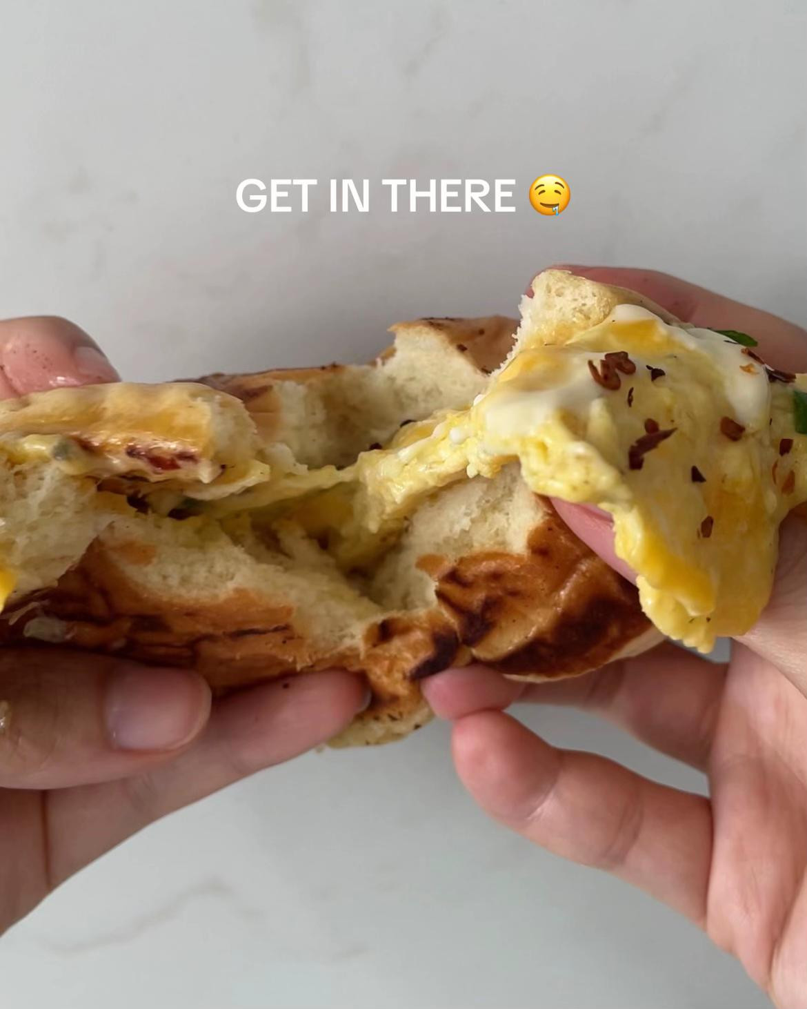 Easy Breakfast Bun with Scrambled Eggs, Melted Cheese, Kewpie Mayo, and Chili Flakes