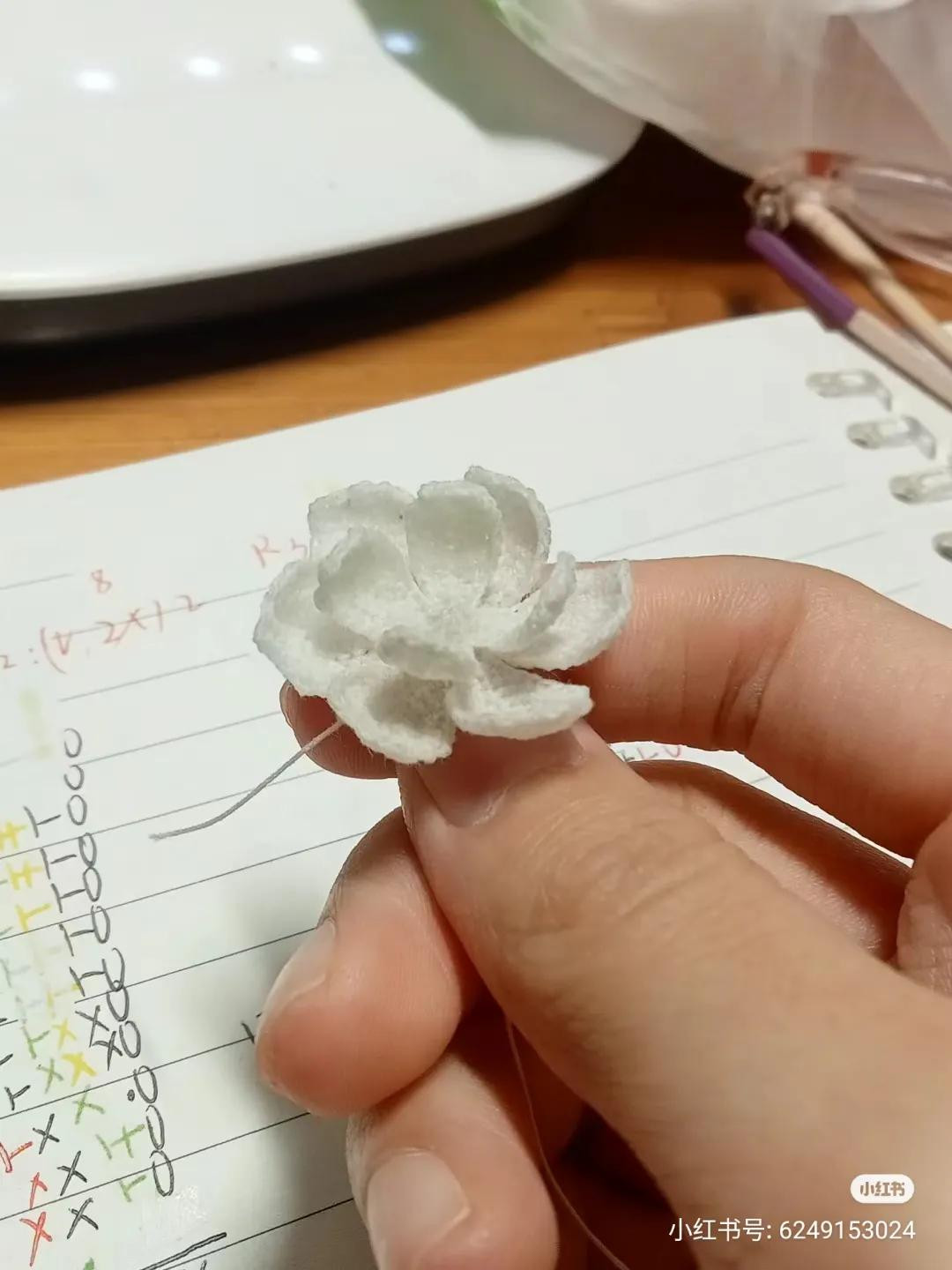 Hand-drawn crochet chart pattern for small flower petals and center