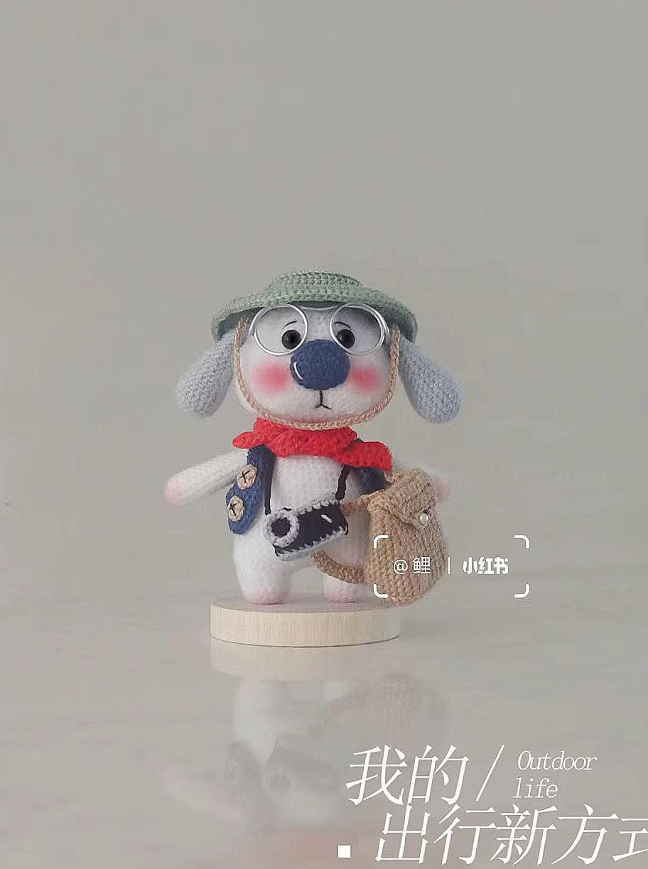Handwritten crochet pattern chart for cute white amigurumi dog character with glasses, hat and accessories
