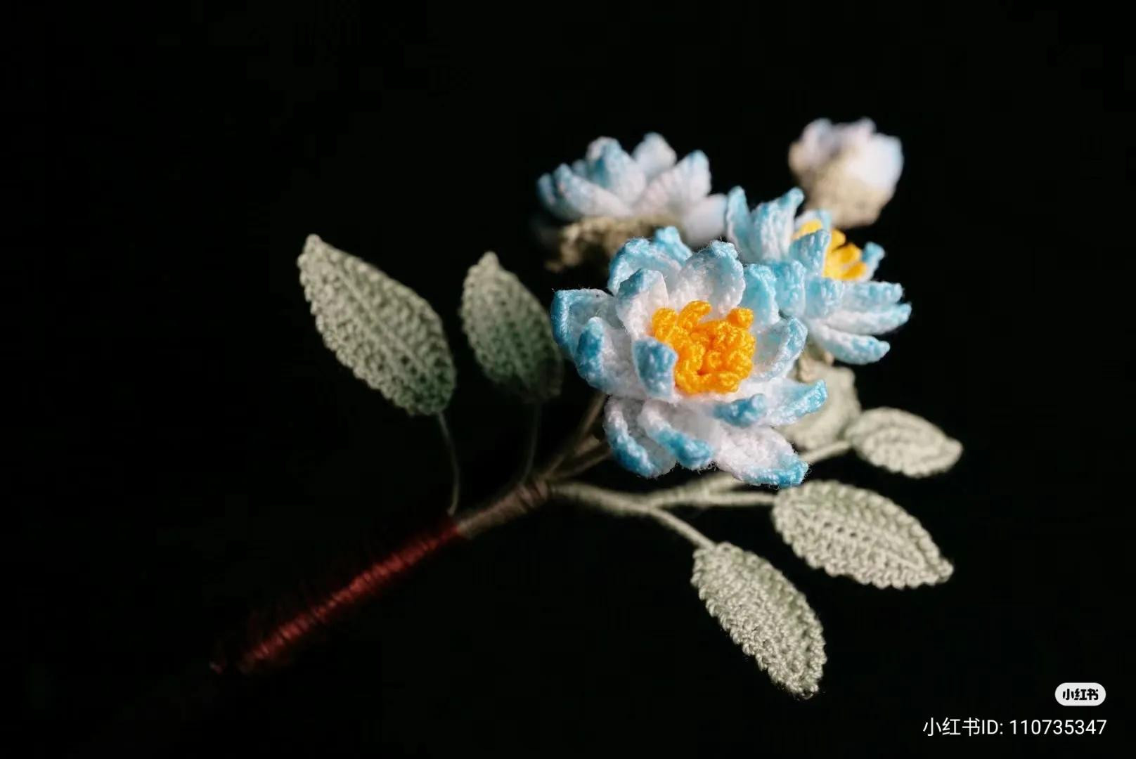 Handwritten Crochet Pattern for Blue and White Flower with Green Leaves