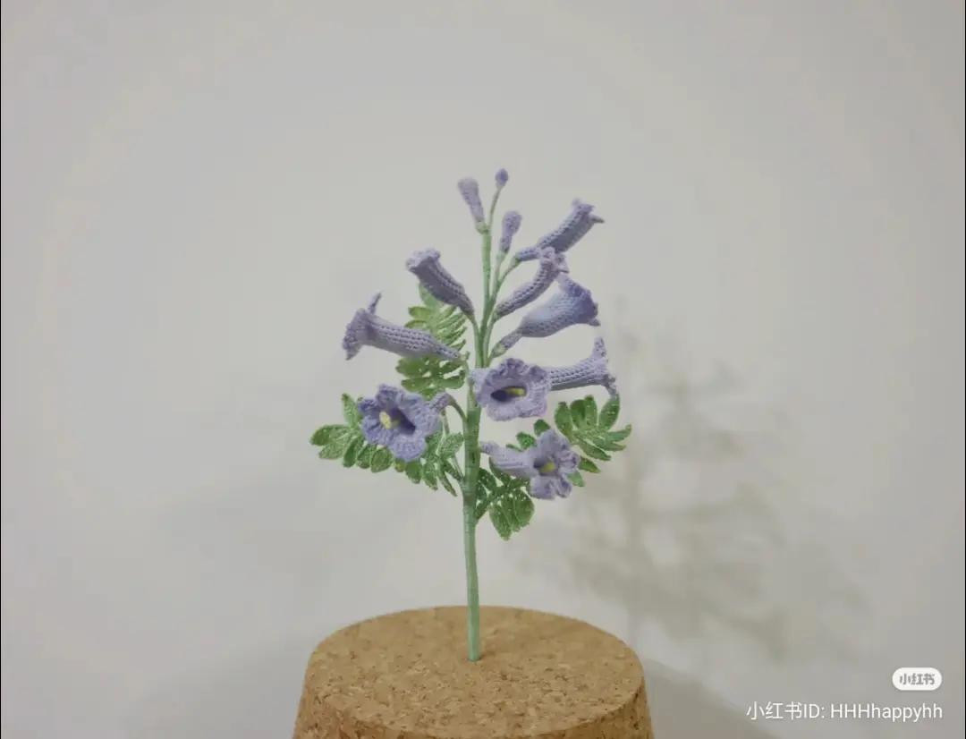 Handwritten Crochet Pattern Tutorial for Blue Delphinium Flower with Detailed Stitch Diagrams