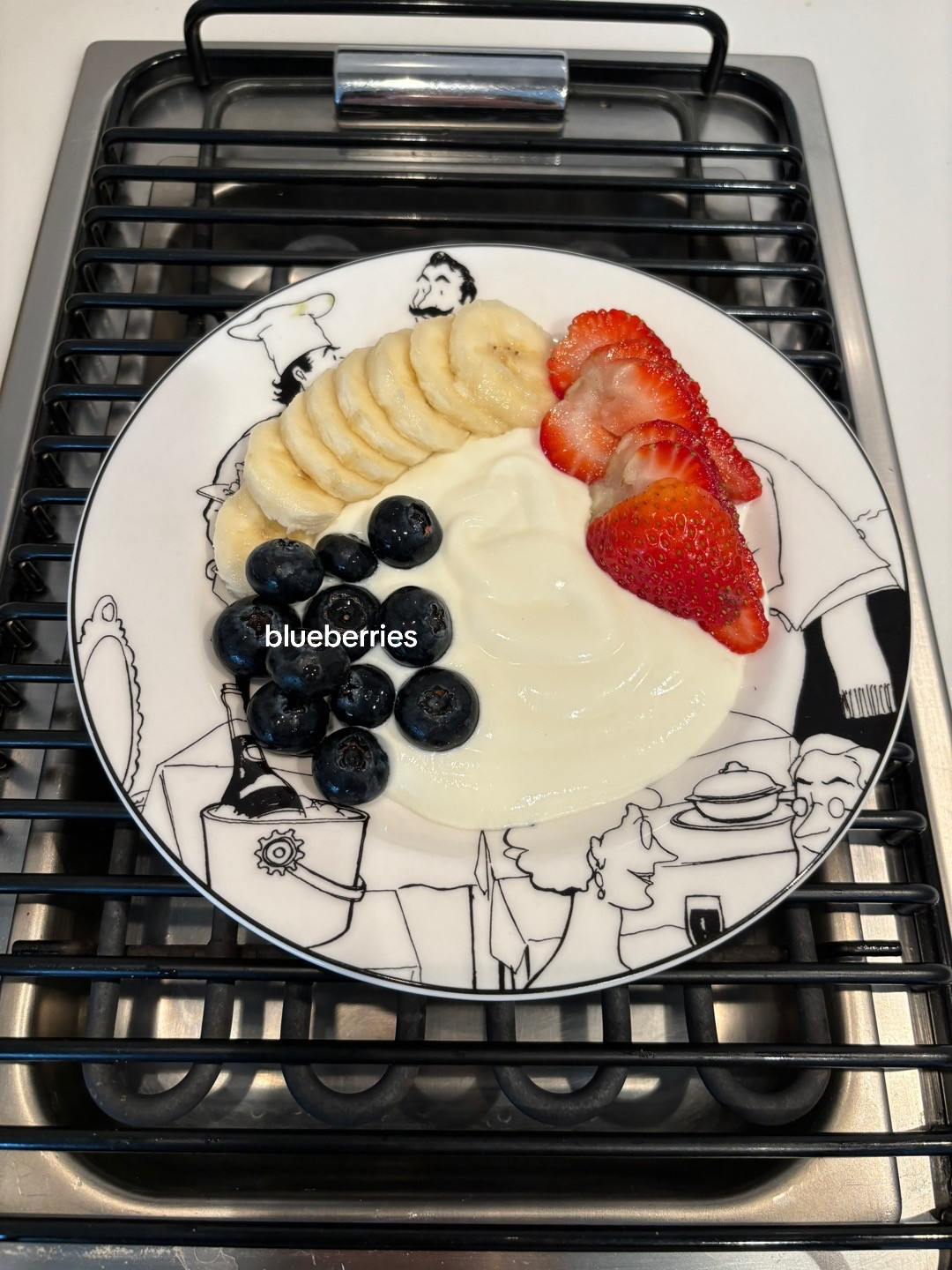 Healthy Yogurt Granola Bowl with Banana, Strawberries, Blueberries and Kiwi