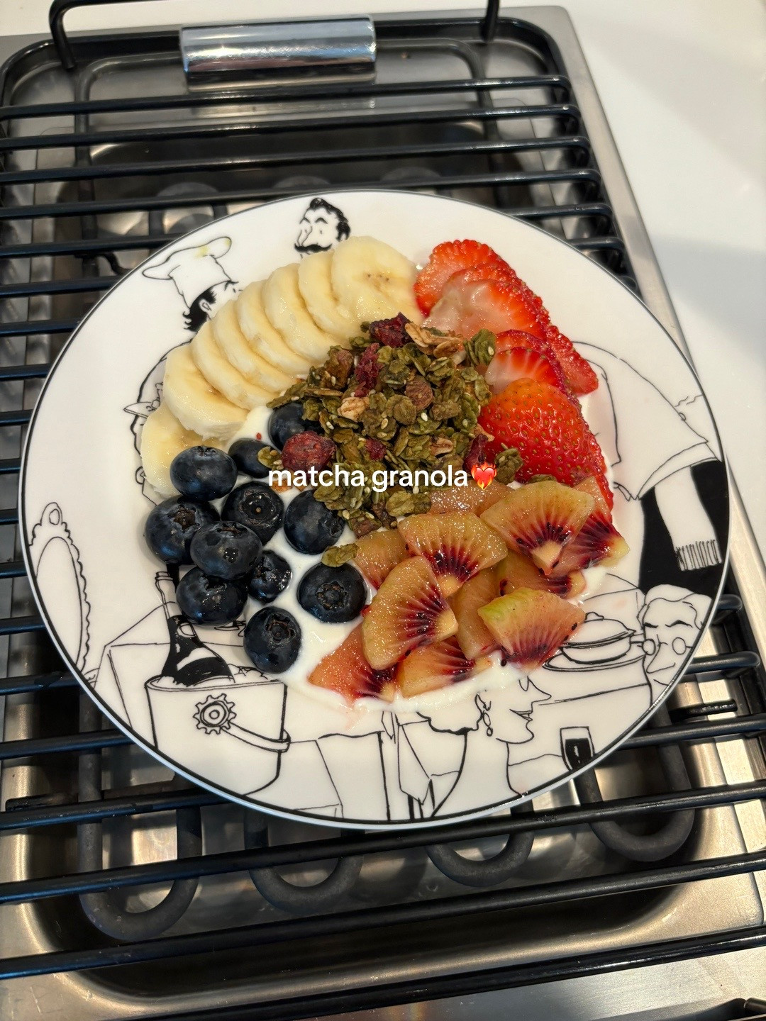Healthy Yogurt Granola Bowl with Banana, Strawberries, Blueberries and Kiwi