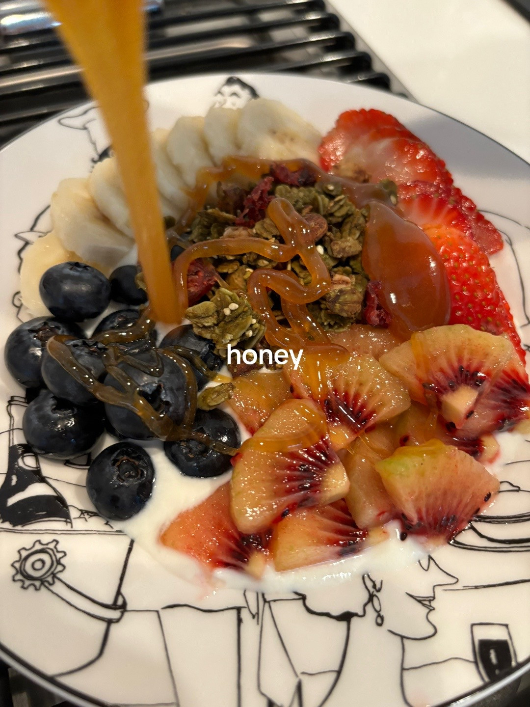 Healthy Yogurt Granola Bowl with Banana, Strawberries, Blueberries and Kiwi
