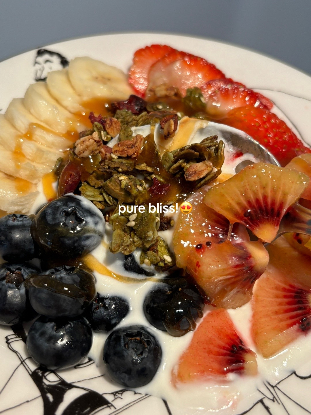 Healthy Yogurt Granola Bowl with Banana, Strawberries, Blueberries and Kiwi