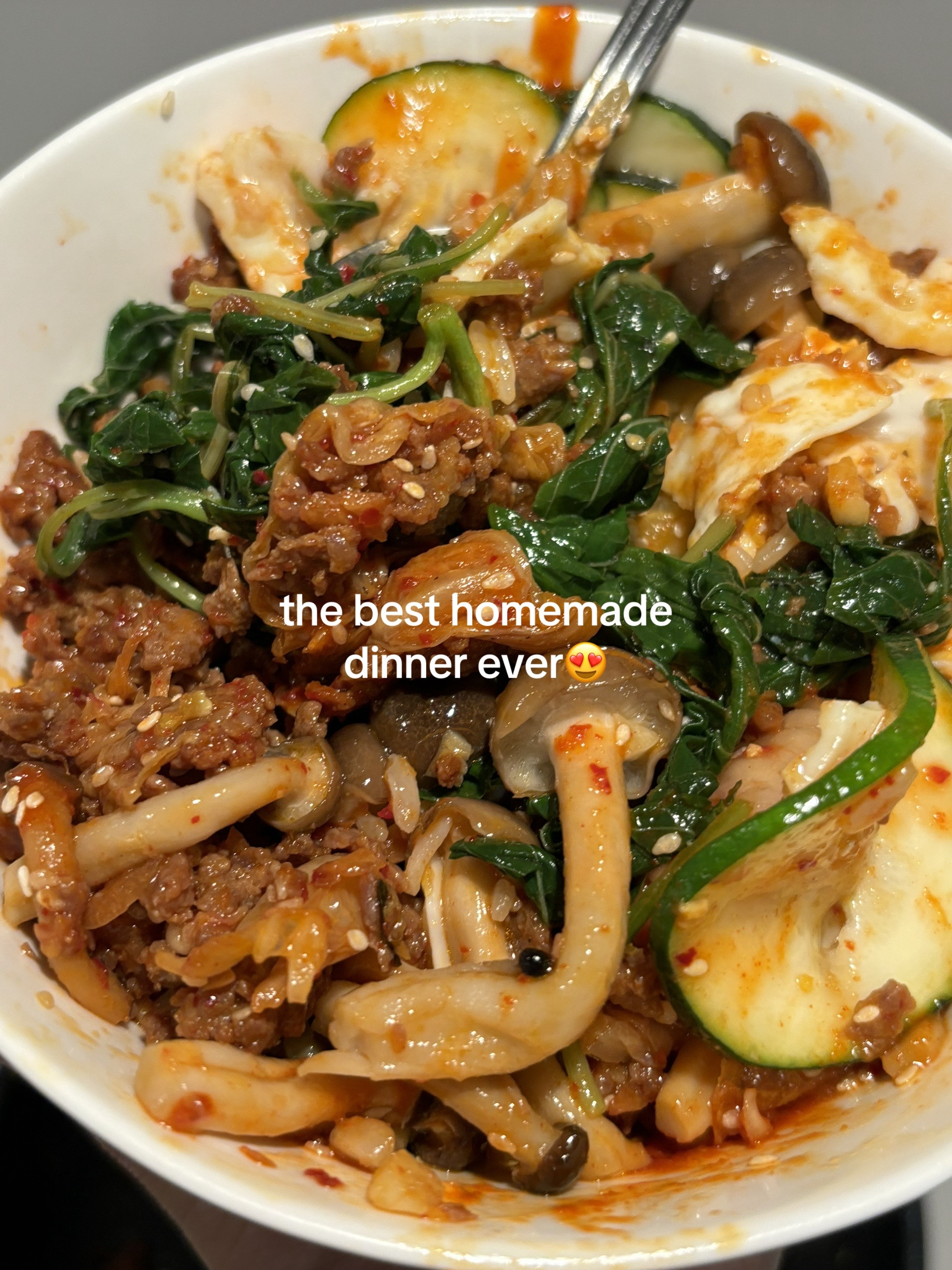 Homemade Beef Bibimbap with Gochujang Sauce, Kimchi, Spinach, Mushrooms and Fried Egg