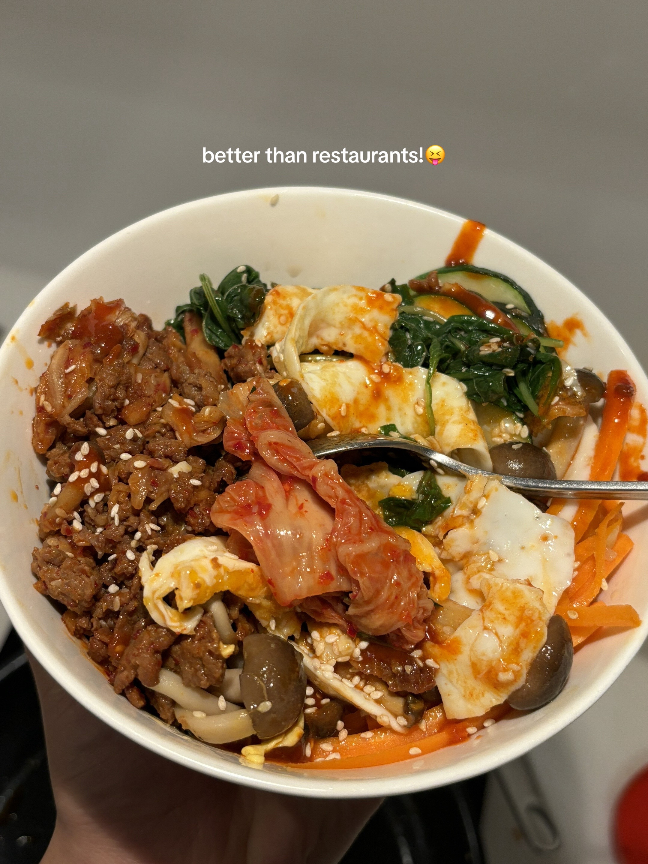 Homemade Beef Bibimbap with Gochujang Sauce, Kimchi, Spinach, Mushrooms and Fried Egg