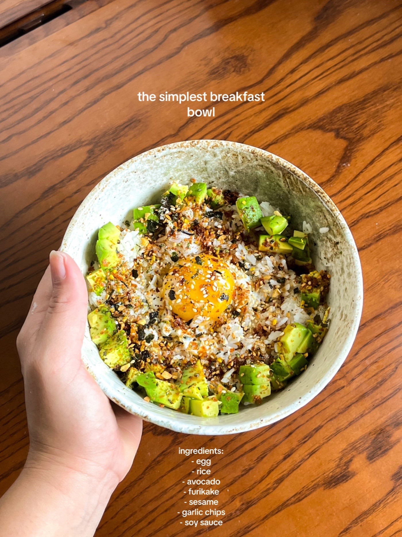 How to make a simple and nourishing onsen egg bowl with rice, avocado, furikake, garlic chips, and sesame