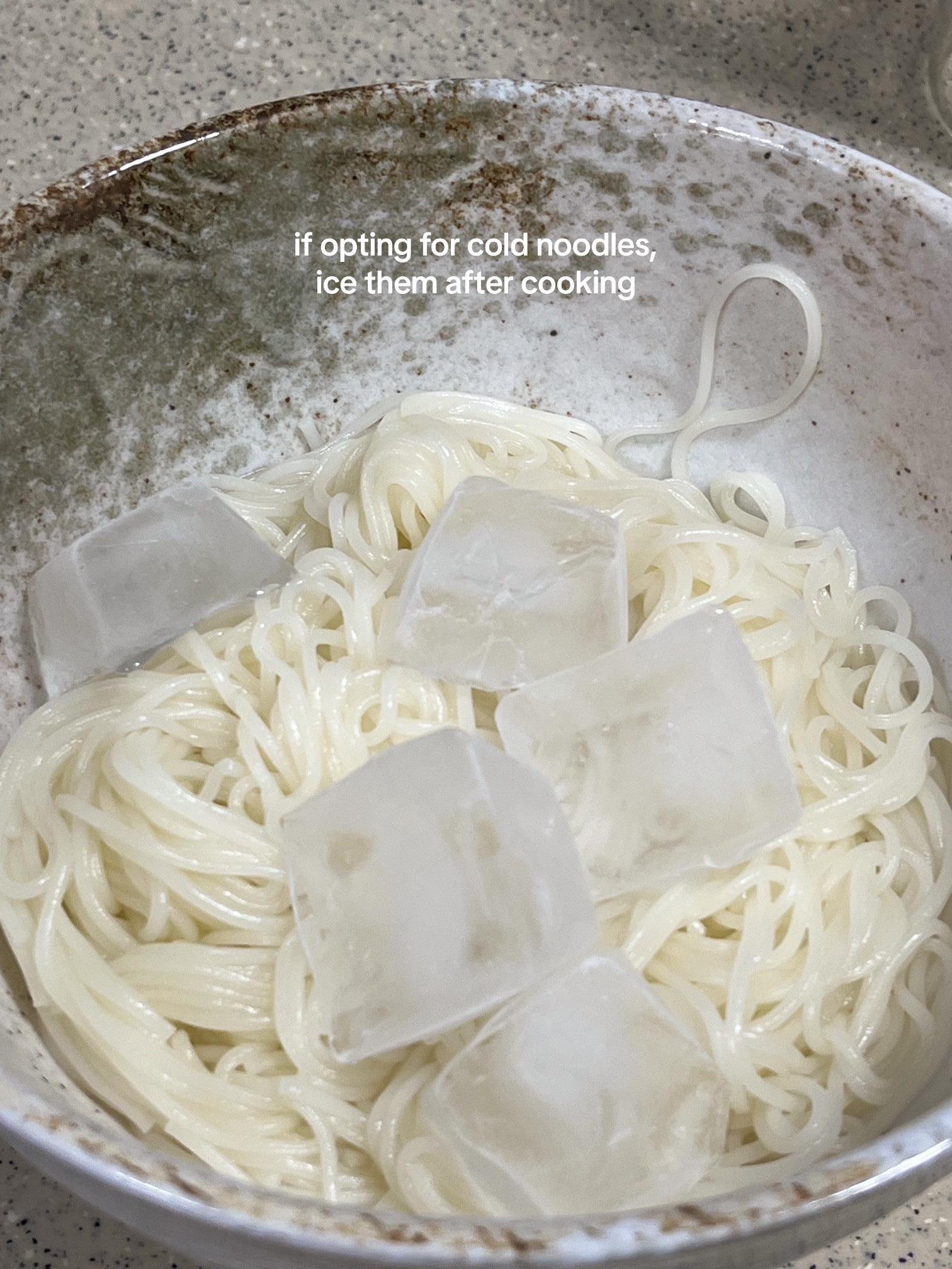 How to make Bibim Guksu: A quick and easy cold noodle dish with sliced cucumbers, soft-boiled eggs, and kimchi