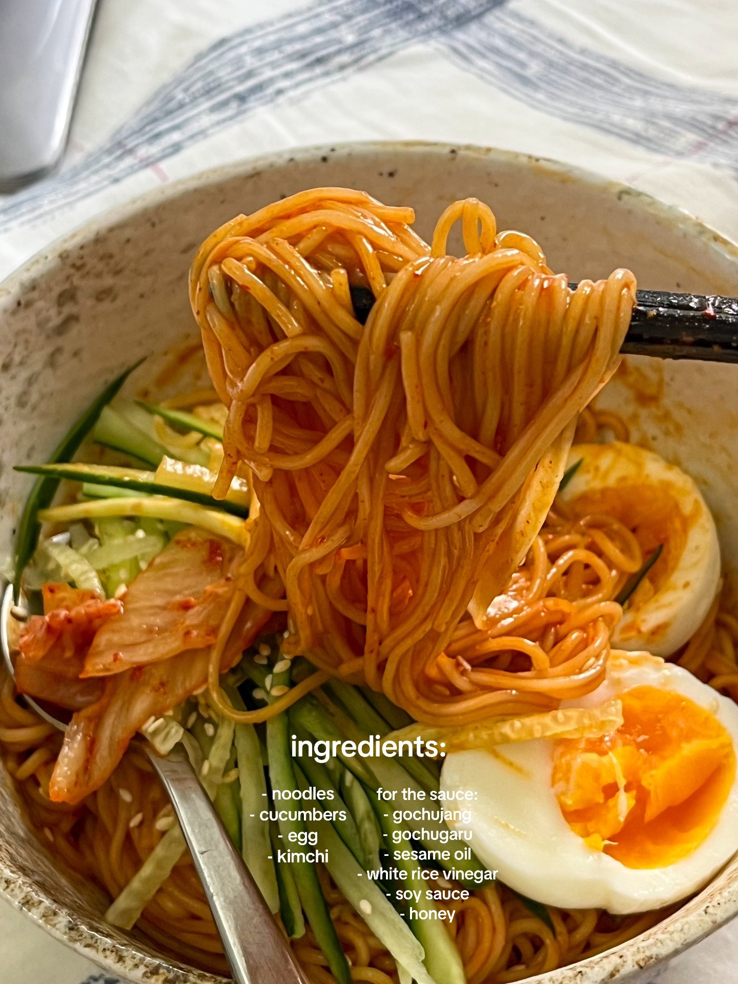 How to make Bibim Guksu: A quick and easy cold noodle dish with sliced cucumbers, soft-boiled eggs, and kimchi