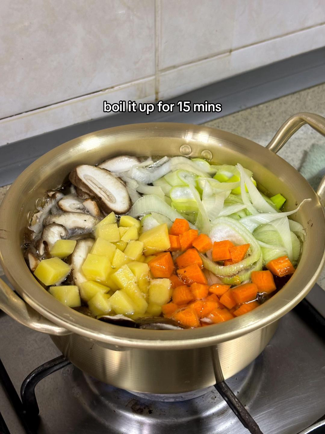 How to make Deonjang Stew with potatoes, carrots, scallions and shiitake mushrooms