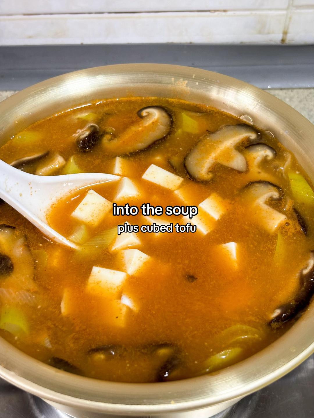 How to make Deonjang Stew with potatoes, carrots, scallions and shiitake mushrooms