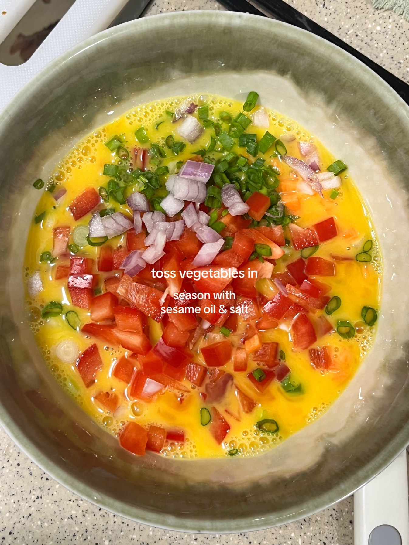 How to make Korean egg rolls with colorful diced vegetables, onions, and spring onions seasoned with sesame oil