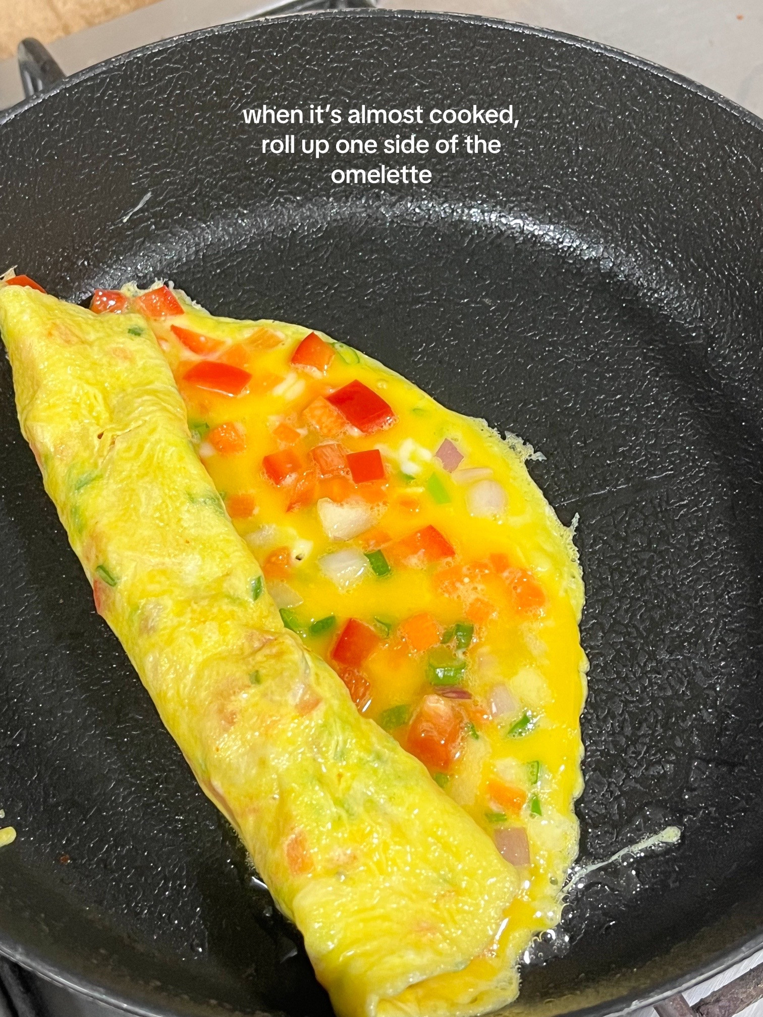 How to make Korean egg rolls with colorful diced vegetables, onions, and spring onions seasoned with sesame oil