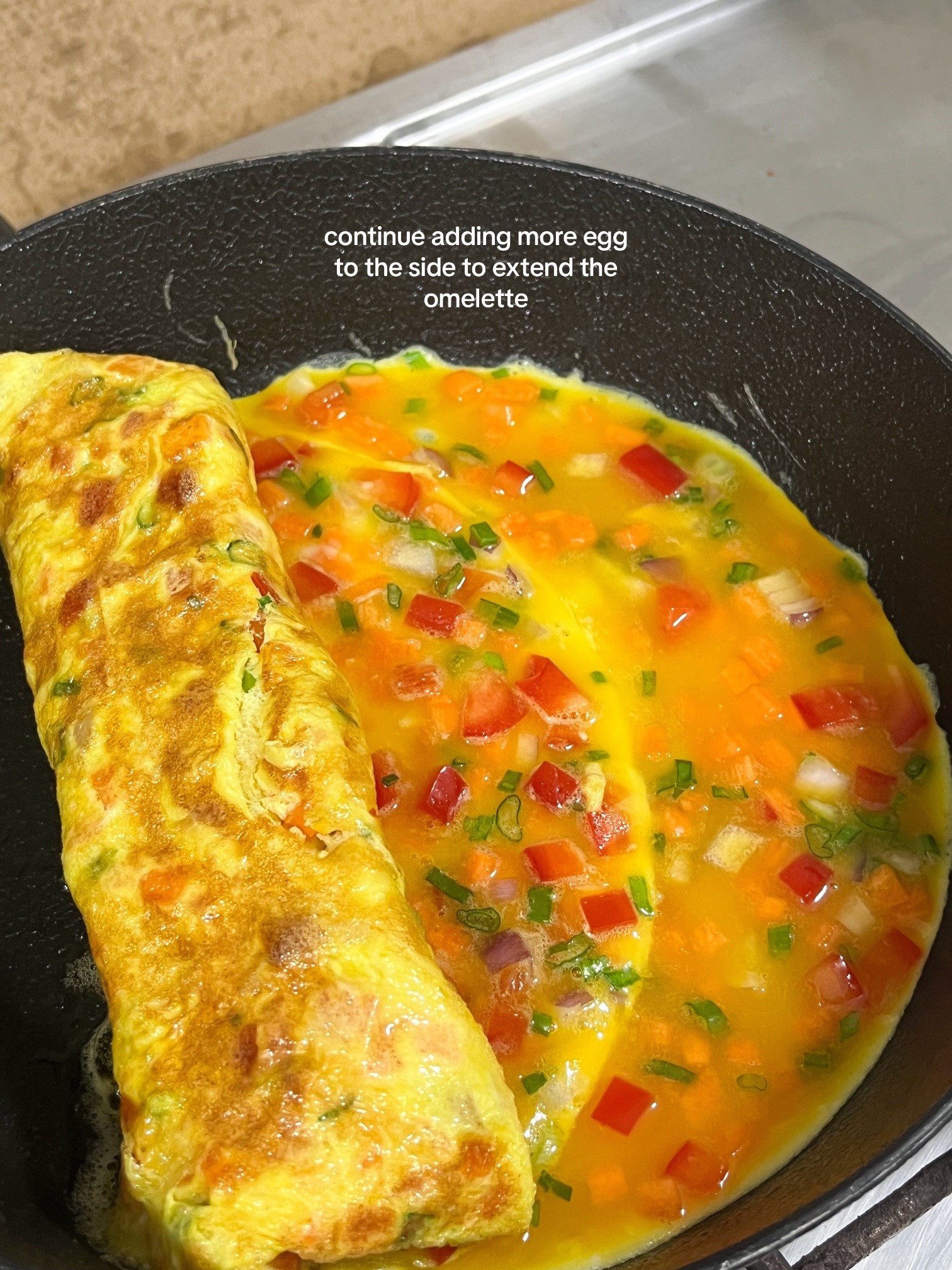 How to make Korean egg rolls with colorful diced vegetables, onions, and spring onions seasoned with sesame oil