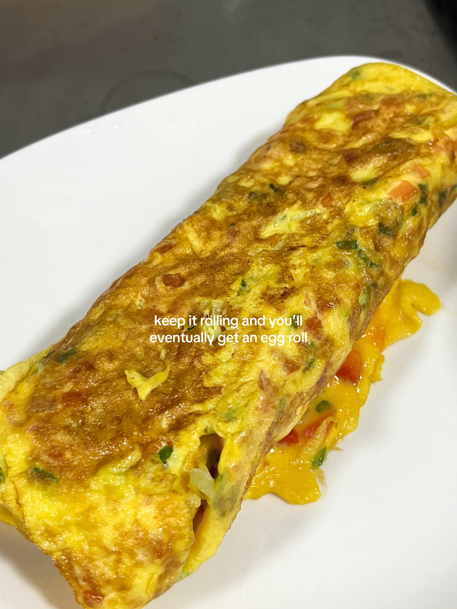 How to make Korean egg rolls with colorful diced vegetables, onions, and spring onions seasoned with sesame oil