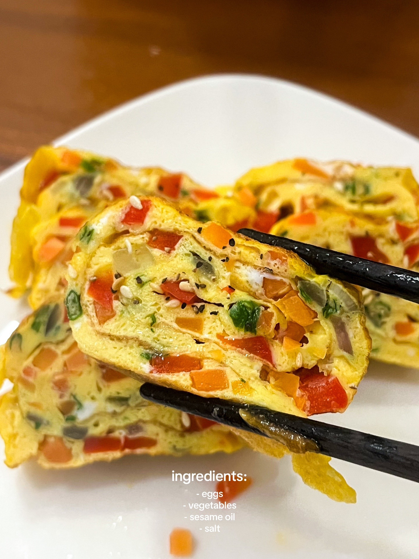 How to make Korean egg rolls with colorful diced vegetables, onions, and spring onions seasoned with sesame oil