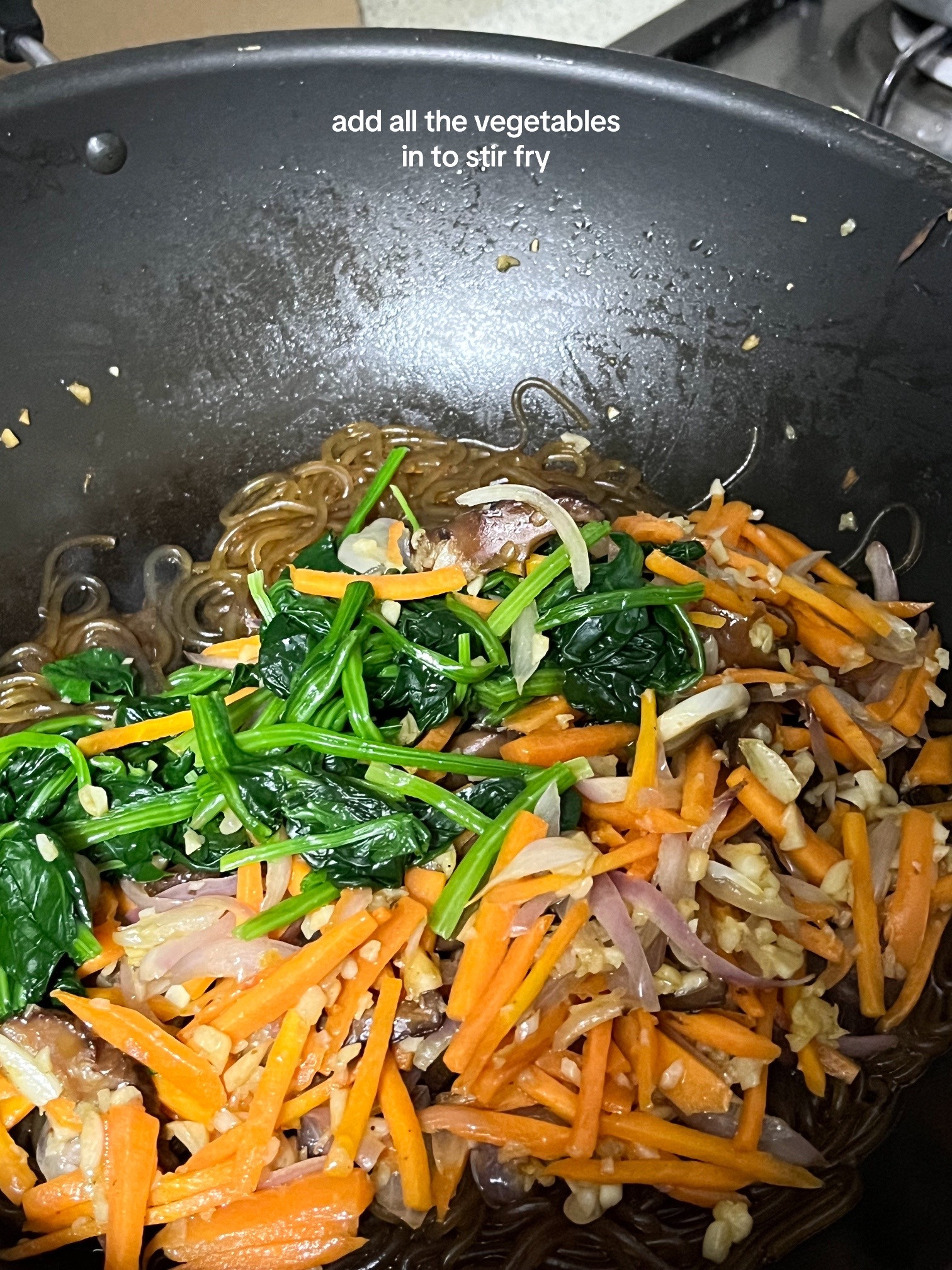 How to make Korean Japchae with spinach, carrots, onions and vermicelli noodles