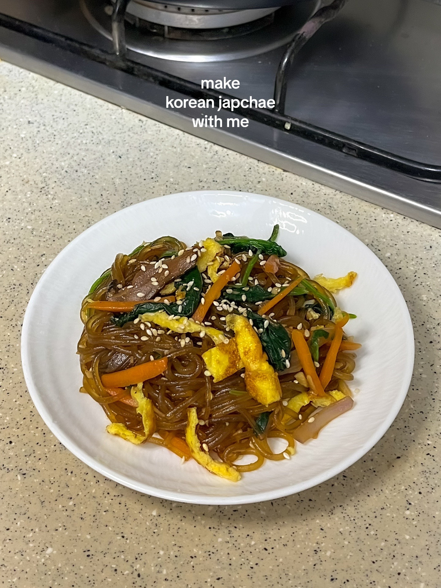 How to make Korean Japchae with spinach, carrots, onions and vermicelli noodles