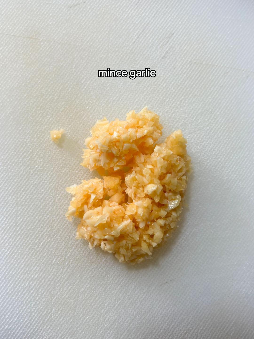 How to plate pesto pasta with minced garlic and Barilla Genovese sauce