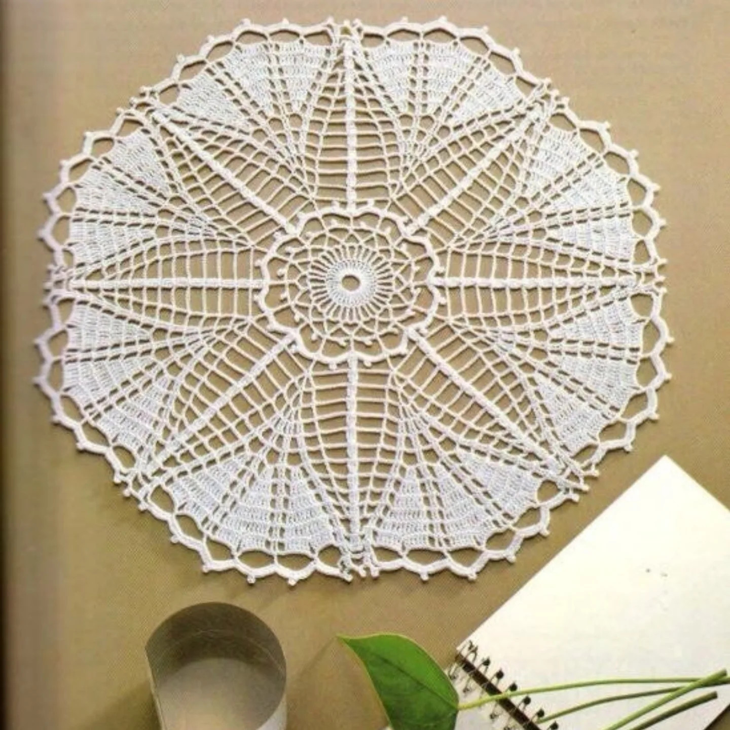 Intricate White Crochet Doily Chart with Star Pattern and Detailed Stitch Diagram