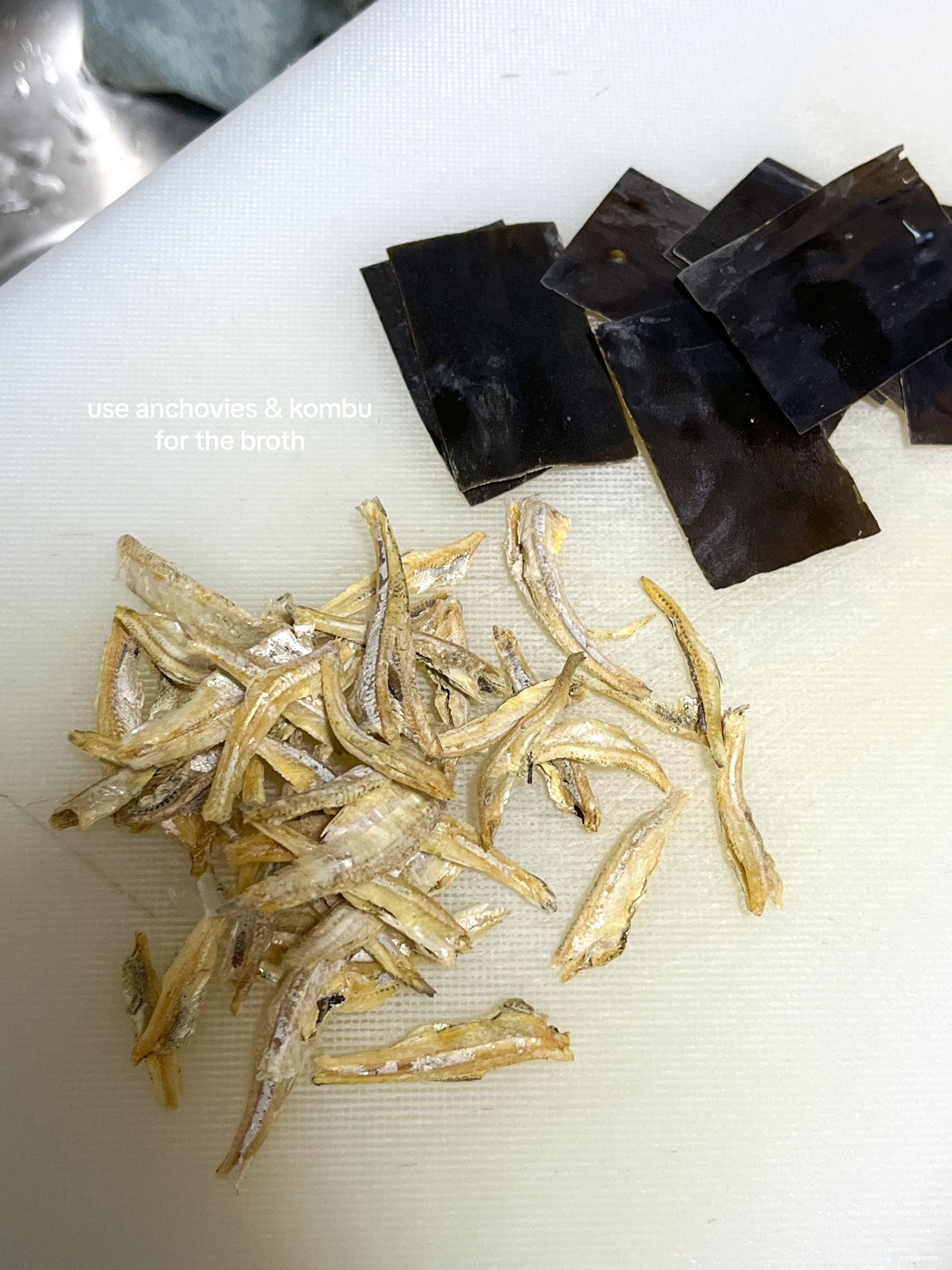 Make kimchi jjigae with me: Korean spicy tofu soup recipe using anchovies, kombu broth, scallions, onions and garlic