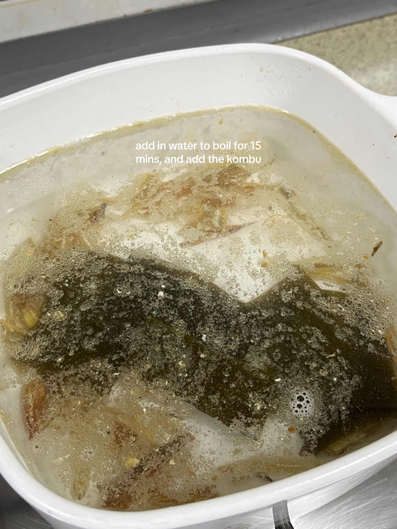 Make kimchi jjigae with me: Korean spicy tofu soup recipe using anchovies, kombu broth, scallions, onions and garlic