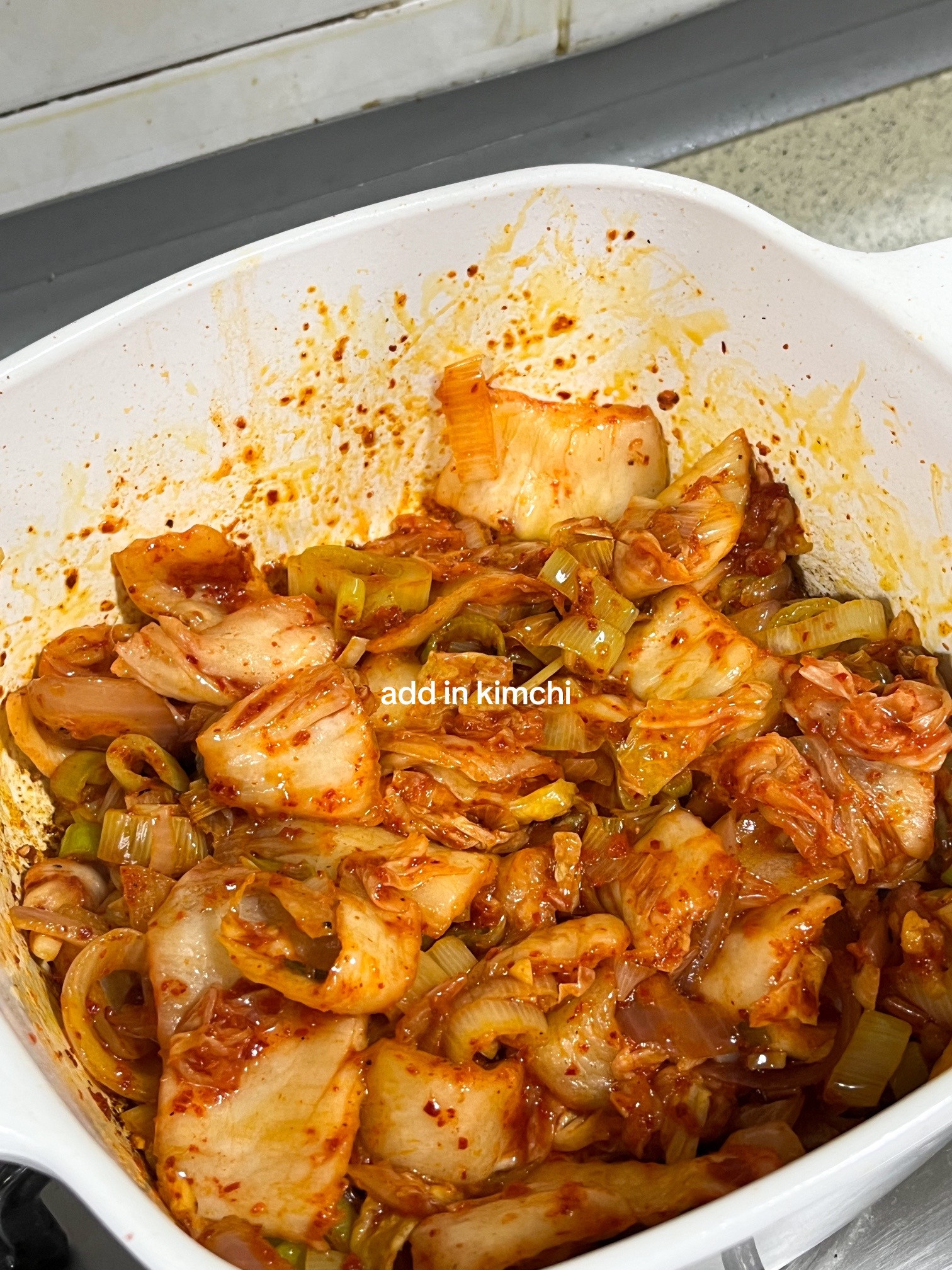 Make kimchi jjigae with me: Korean spicy tofu soup recipe using anchovies, kombu broth, scallions, onions and garlic