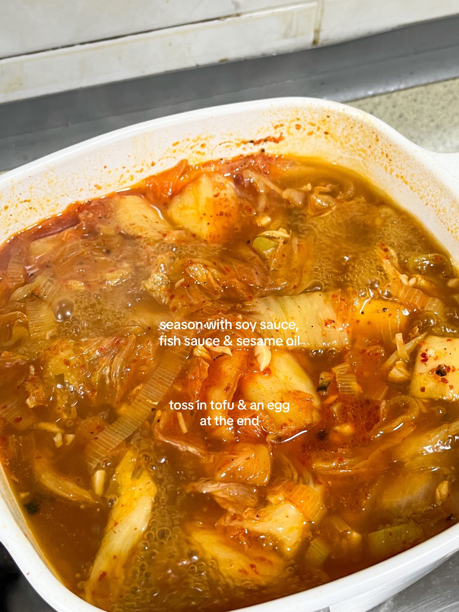 Make kimchi jjigae with me: Korean spicy tofu soup recipe using anchovies, kombu broth, scallions, onions and garlic
