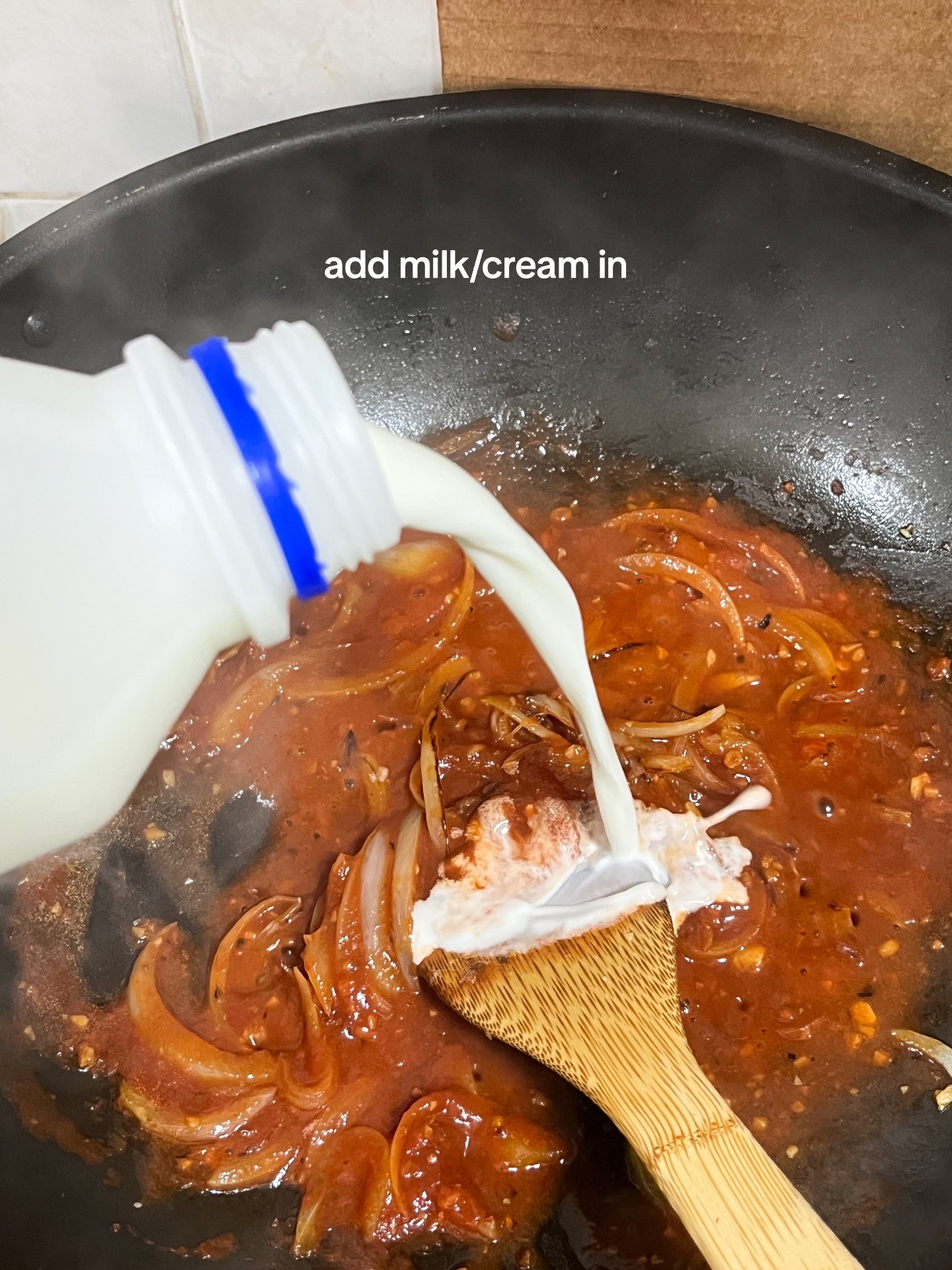 Make Rosé Mafaldine Pasta with Creamy Tomato Sauce, Garlic and Onions