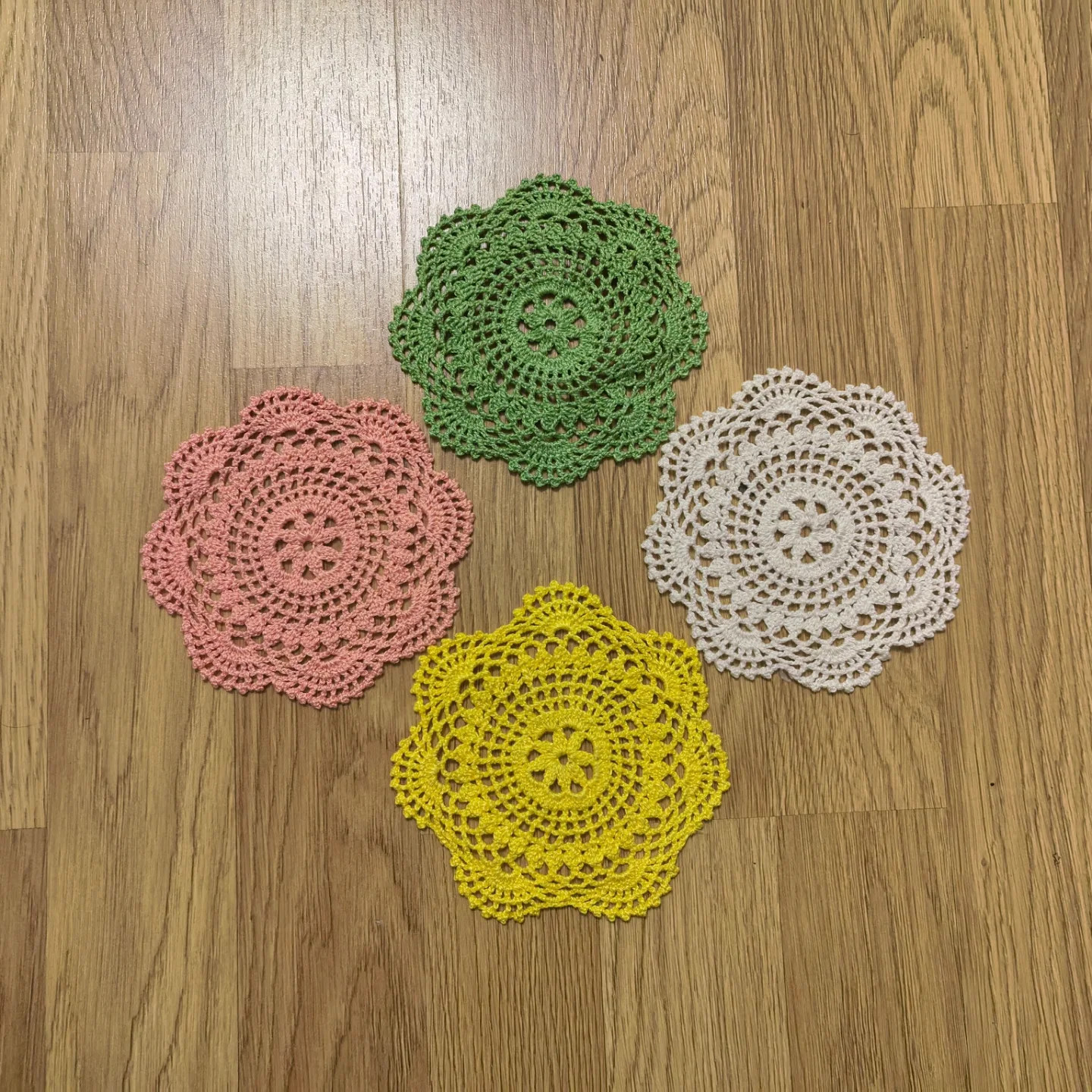 Mini Crochet Doilies Pattern: Intricate Lace Design in Pink, Green, White, and Yellow Yarn