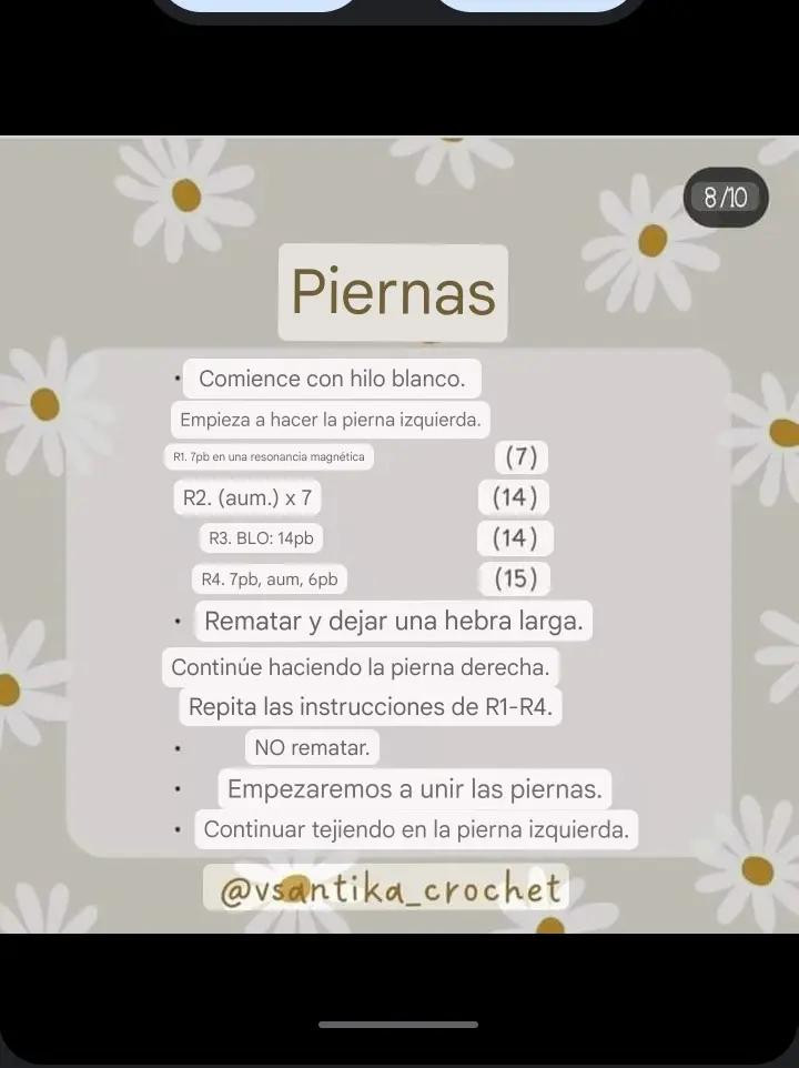 Patrón gratuito de crochet para perro amigurumi blanco y negro con ropa azul