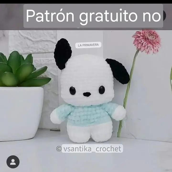 Patrón gratuito de crochet para perro amigurumi blanco y negro con ropa azul