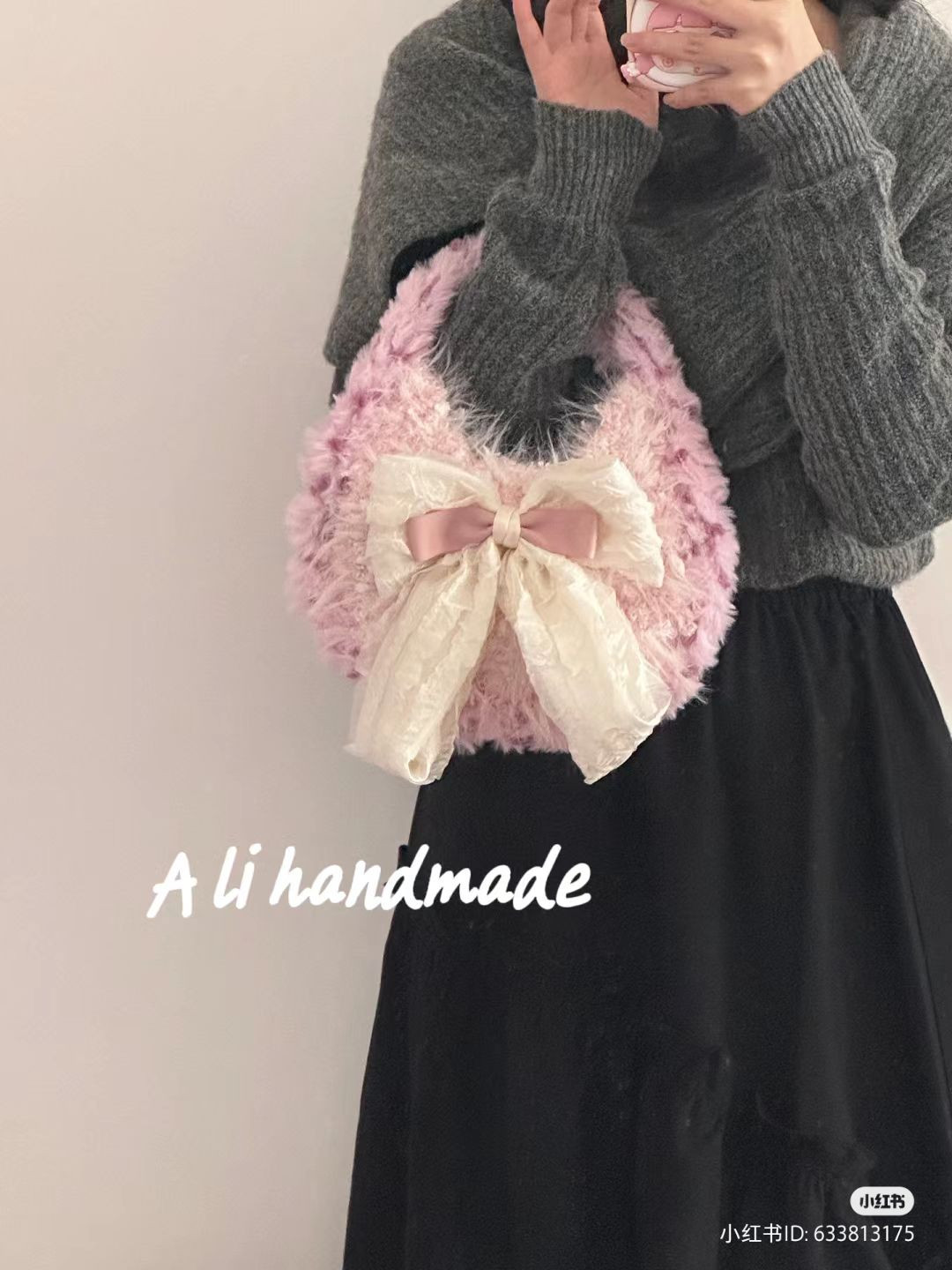 Pink fluffy crocheted handbag with large cream bow pattern