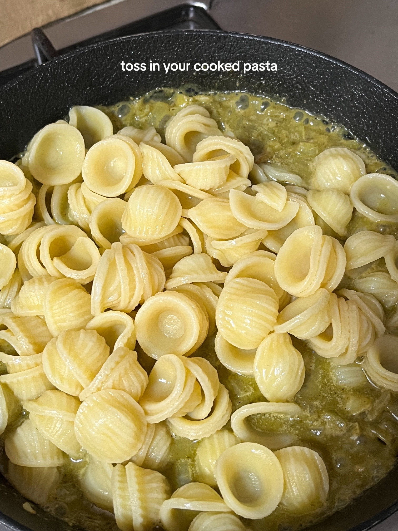 Quick and Easy Pesto Pasta Recipe with Garlic, Onions, and Cherry Tomatoes