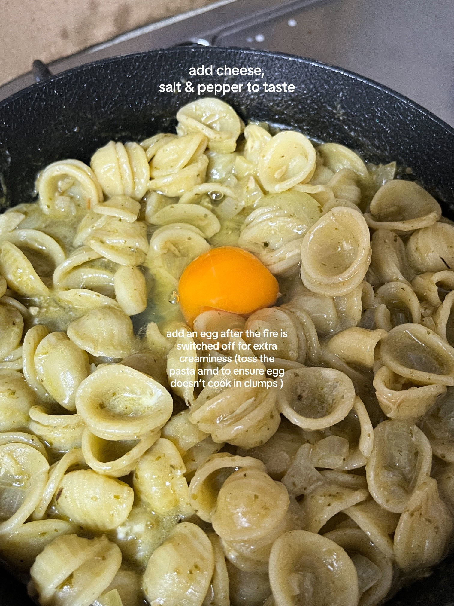 Quick and Easy Pesto Pasta Recipe with Garlic, Onions, and Cherry Tomatoes