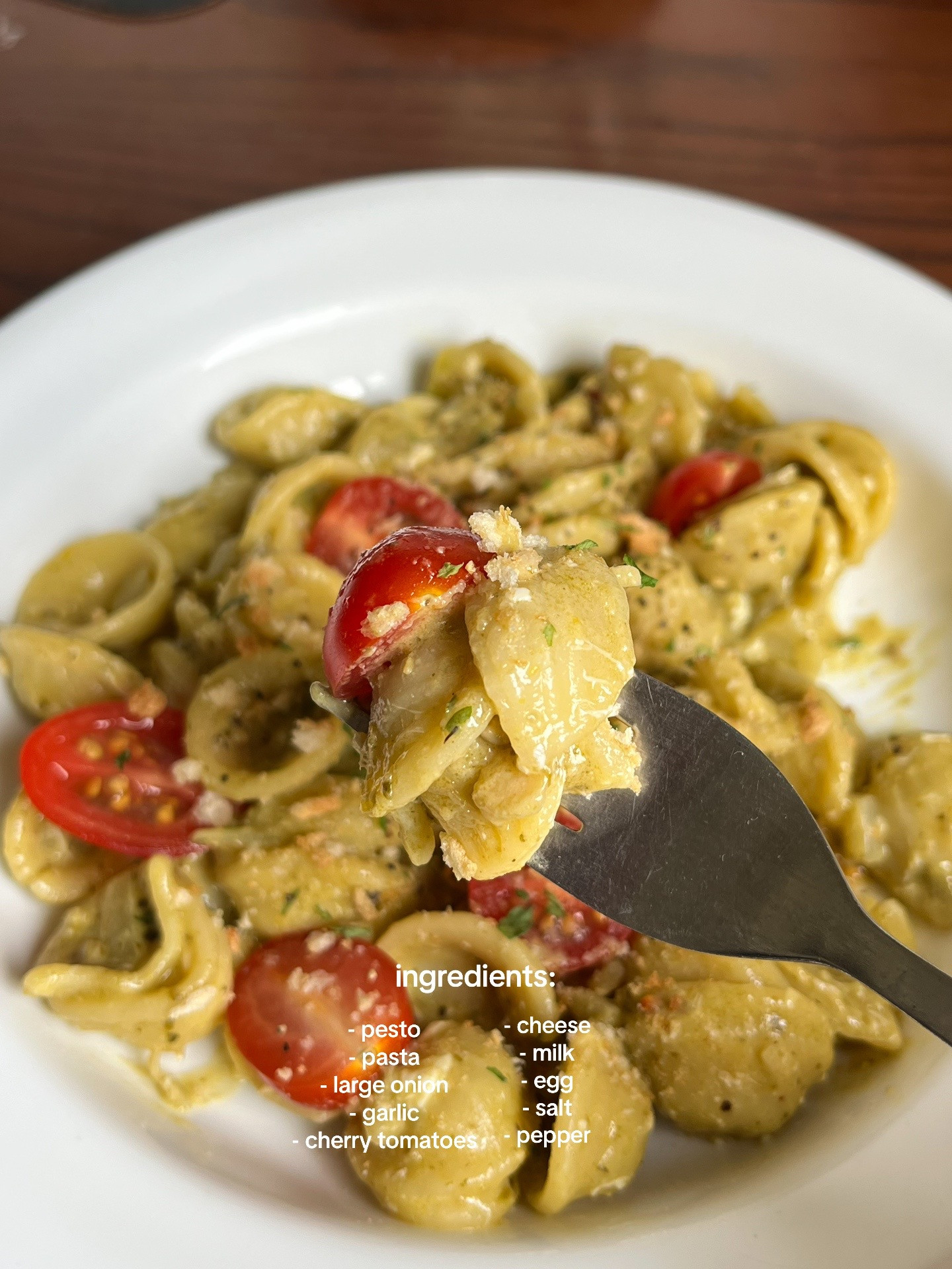Quick and Easy Pesto Pasta Recipe with Garlic, Onions, and Cherry Tomatoes