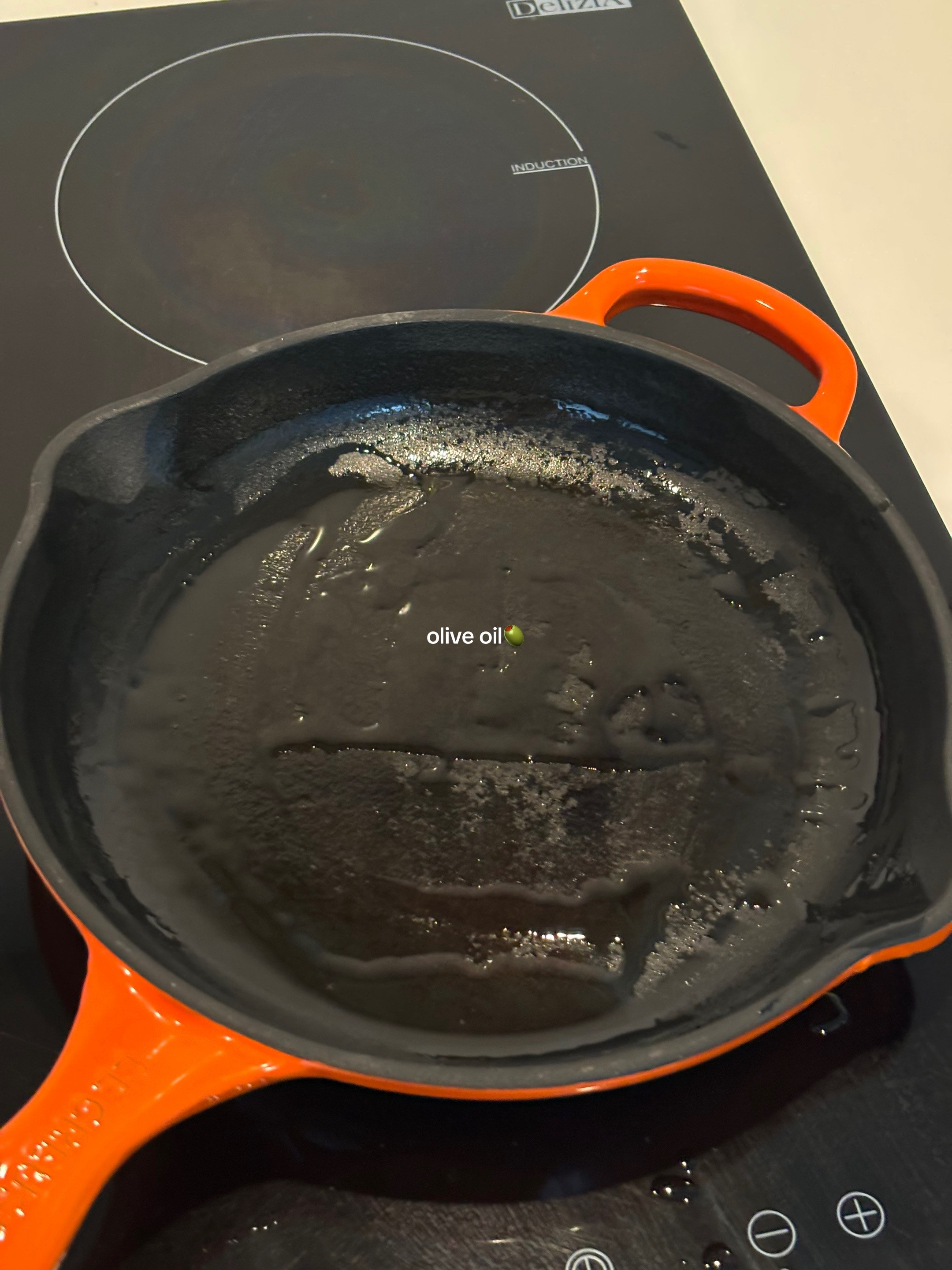 Quick, easy, healthy breakfast frittata with cherry tomatoes and greens cooked in Le Creuset cast iron skillet