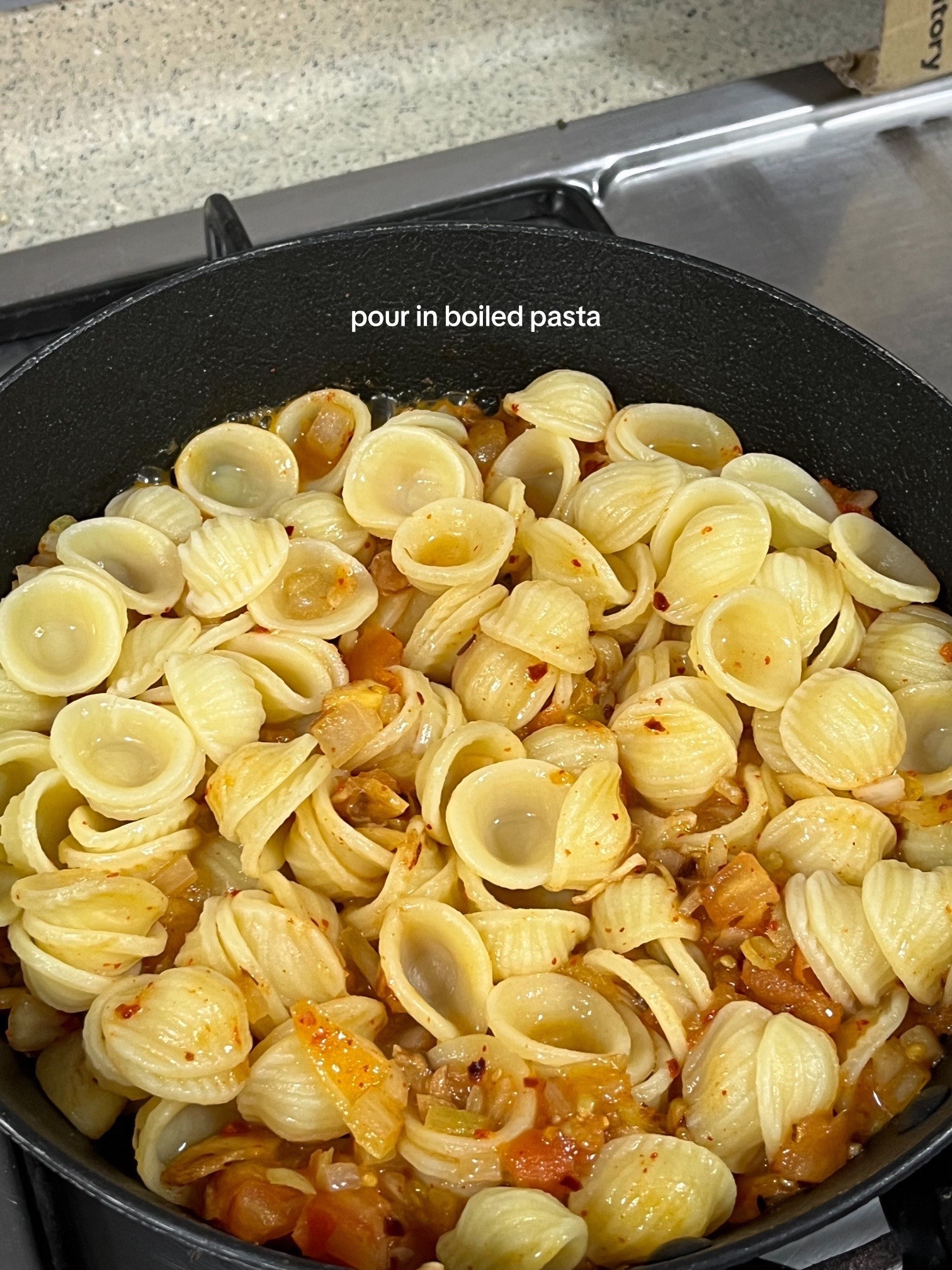 Spicy Tomato Cream Pasta Recipe: Diced onions, garlic, tomatoes