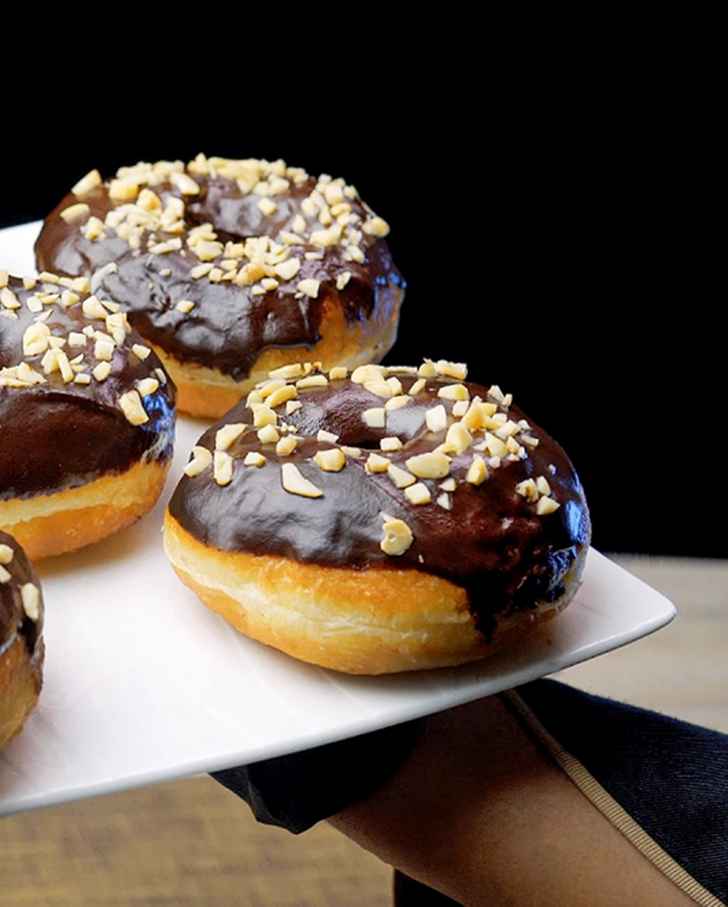 The Perfect Donut Recipe: Soft and Fluffy Chocolate Ring Donuts with Chopped Nuts