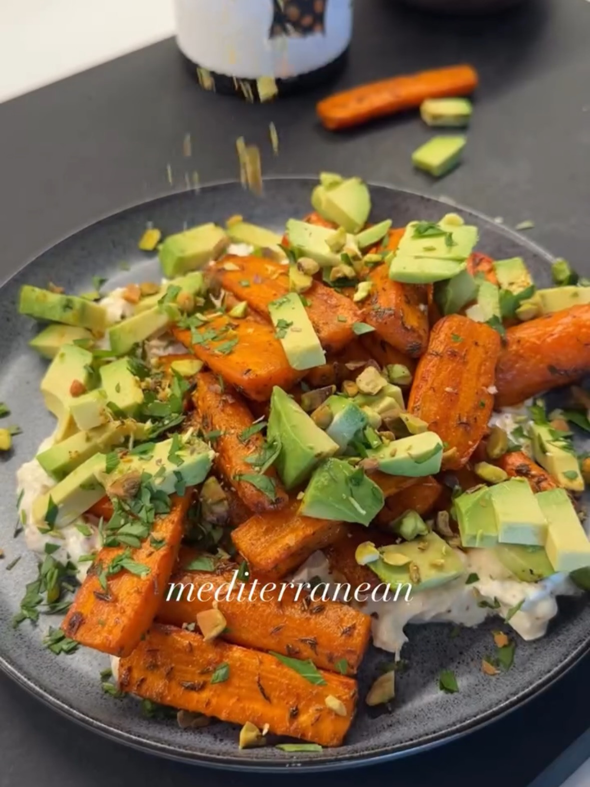 Warm Mediterranean Carrot Salad with Yogurt Feta Sauce, Avocado, and Pistachios