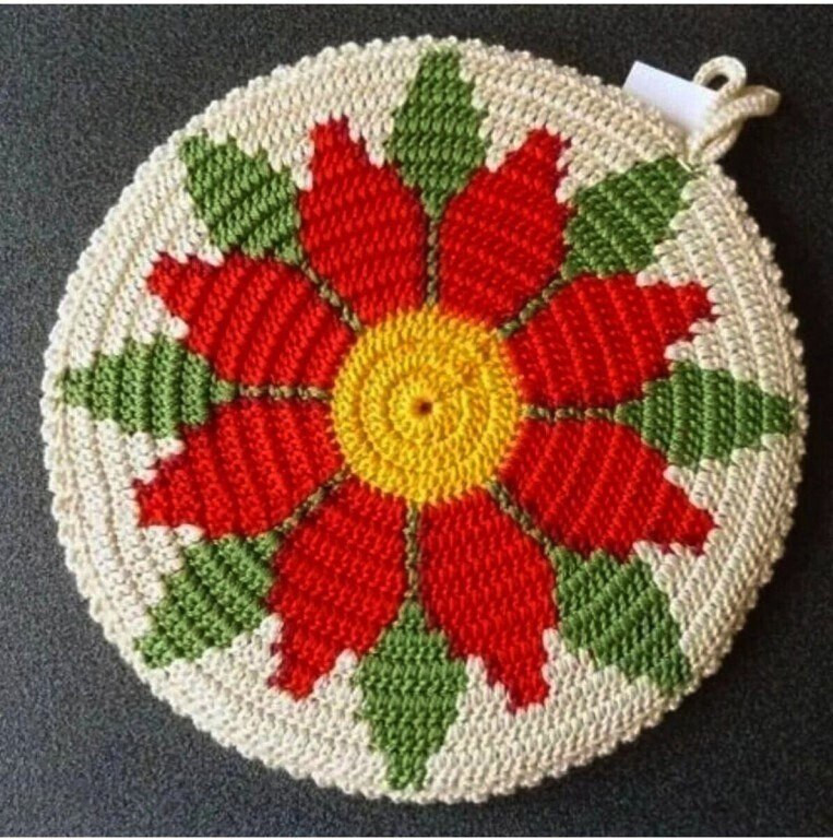 Bright crocheted potholders: yellow hexagon, floral round, and red-green diamond patterns with charts